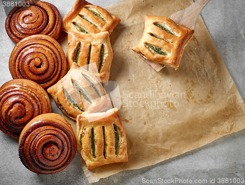 Image of freshly baked cinnamon and spinach buns