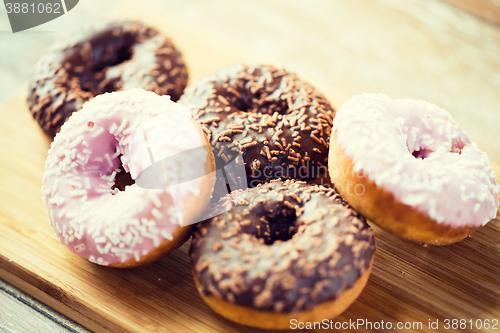 Image of close up of glazed donuts pile on table