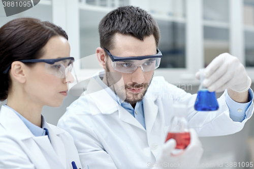 Image of young scientists making test or research in lab