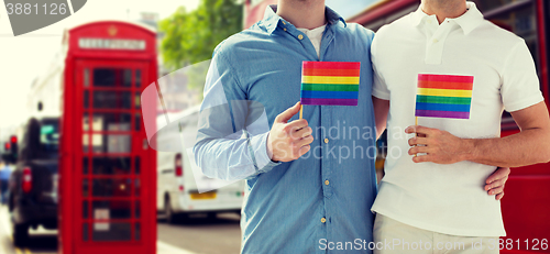 Image of close up of gay couple hugging over london city
