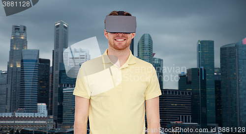 Image of happy man in virtual reality headset or 3d glasses