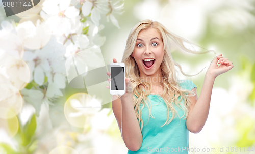 Image of happy young woman or teenage girl with smartphone