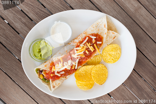 Image of Traditional mexican tortilla wrap on plate