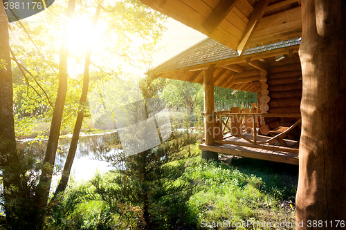 Image of Wooden house and pond