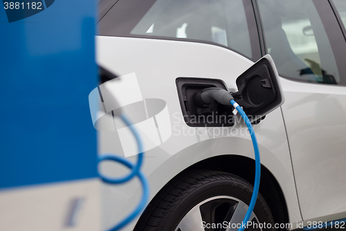 Image of Electric Car in Charging Station.