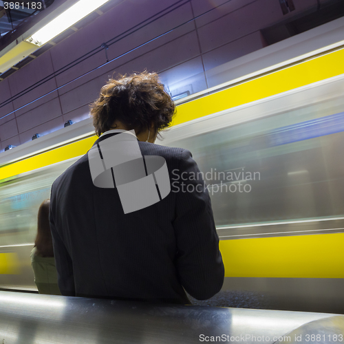 Image of Passengers traveling by Tokyo metro.