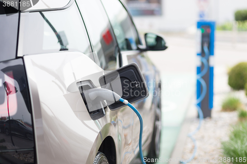 Image of Electric Car in Charging Station.