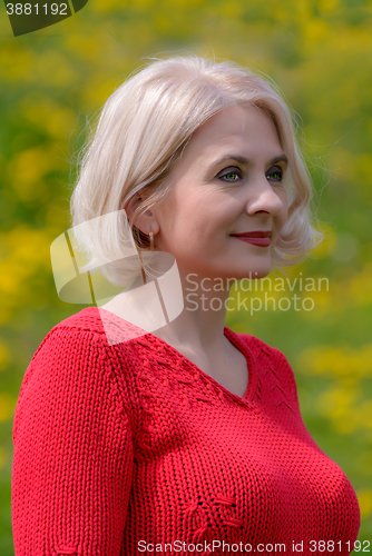 Image of Blonde in a red pullover