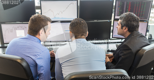 Image of Business people looking at computer screens.