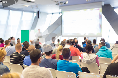 Image of Male speeker having talk at public event.