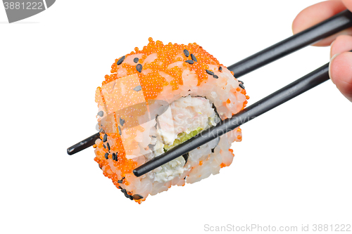 Image of Sushi roll with black chopsticks 