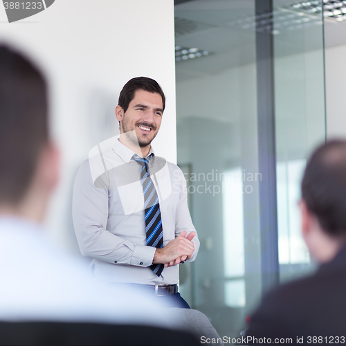 Image of Relaxed informal business team office meeting.