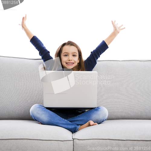 Image of Little girl working with a laptop