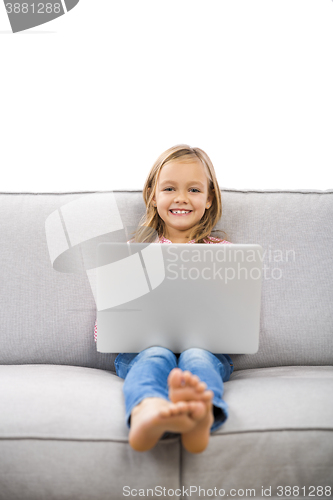 Image of Little girl working with a laptop
