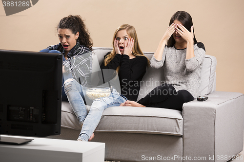 Image of Scared teenage watching movies 