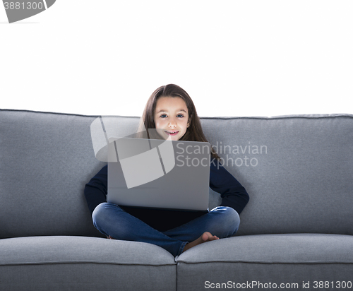 Image of Little girl working with a laptop