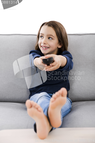 Image of Girl holding a TV remote