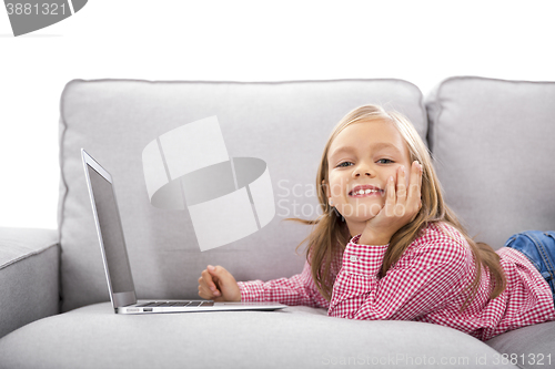Image of Little girl working with a laptop