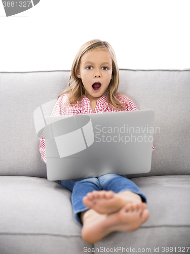 Image of Little girl working with a laptop