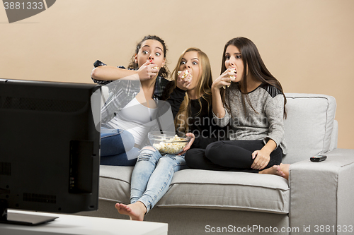 Image of Scared teenage watching movies 