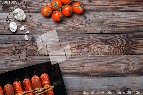 Image of Sausage roasted on the grill.