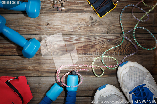 Image of Sport stuff on wooden table, top view