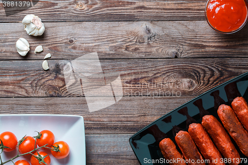 Image of Sausage roasted on the grill.