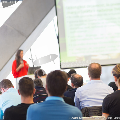 Image of Female speeker having talk at public event.