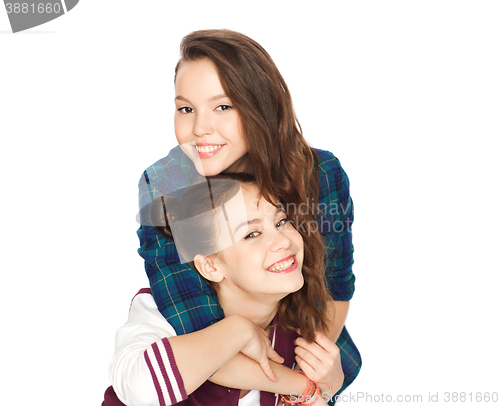 Image of happy smiling pretty teenage girls hugging