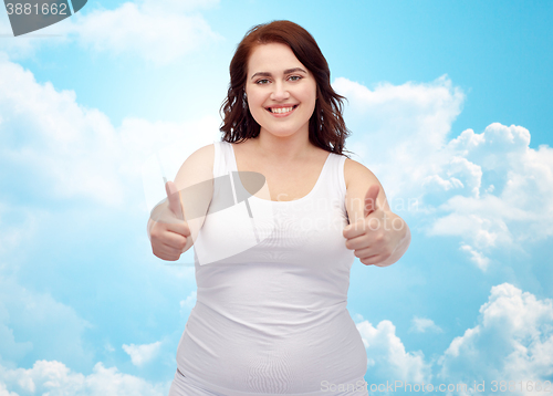 Image of plus size woman in underwear showing thumbs up