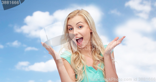 Image of surprised smiling young woman or teenage girl