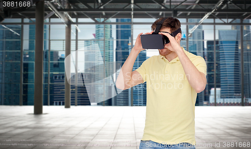 Image of happy man in virtual reality headset or 3d glasses