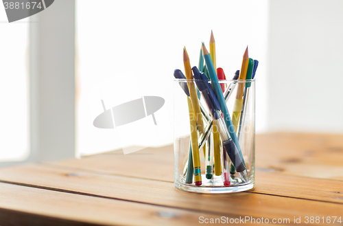 Image of close up of stand or glass with pens and pencils