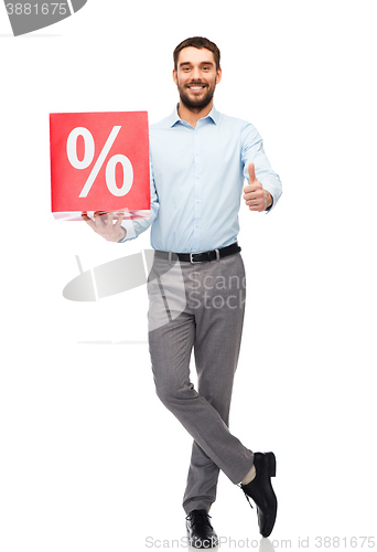 Image of smiling man with red shopping bag