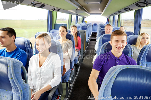 Image of group of happy passengers in travel bus