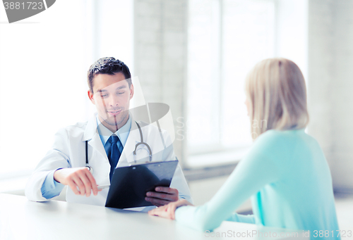 Image of doctor with patient in hospital