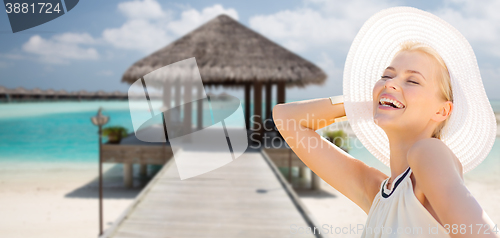 Image of beautiful woman enjoying summer over exotic beach