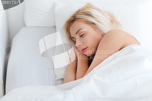 Image of young woman sleeping in bed at home bedroom