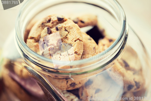 Image of close up of chocolate oatmeal cookies in glass jar