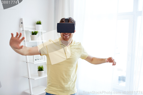 Image of young man in virtual reality headset or 3d glasses