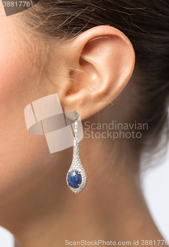 Image of close up of beautiful woman face with earring