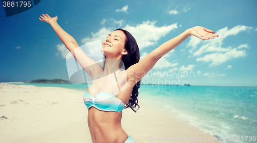 Image of happy woman in bikini swimsuit with raised hands