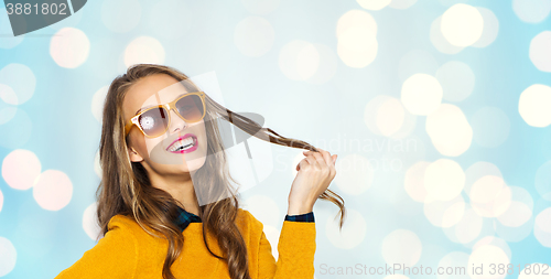 Image of happy young woman or teen girl in sunglasses