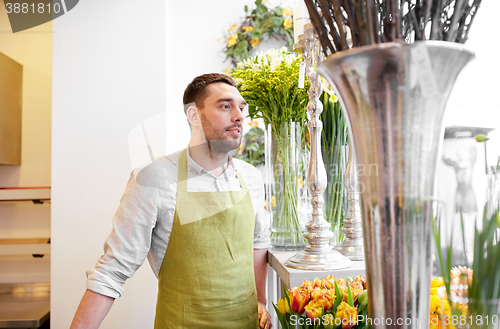 Image of florist man or seller at flower shop