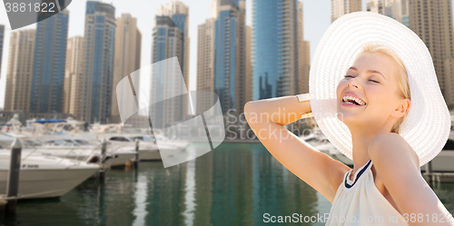 Image of happy woman enjoying summer over dubai city harbor