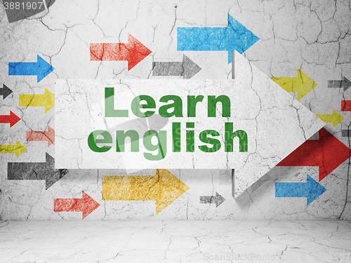 Image of Education concept: arrow with Learn English on grunge wall background