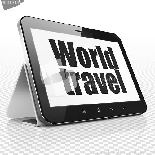 Image of Tourism concept: Tablet Computer with World Travel on display