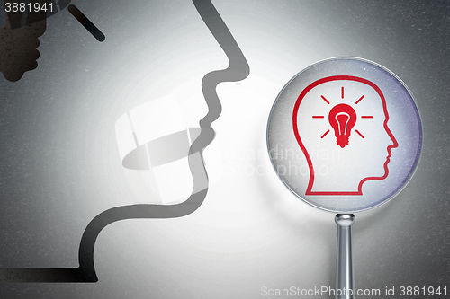 Image of Finance concept:  Head With Lightbulb with optical glass on digital background