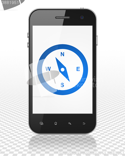 Image of Vacation concept: Smartphone with Compass on display