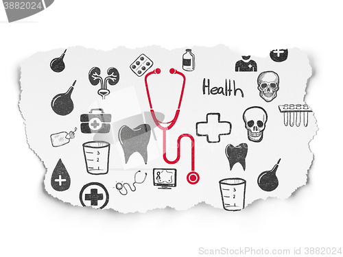 Image of Health concept: Stethoscope on Torn Paper background